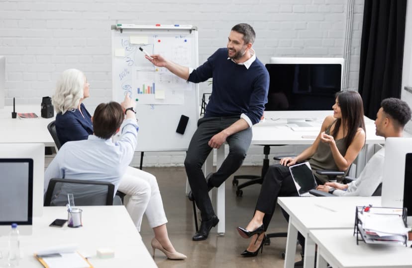 group of people in a meeting in an office