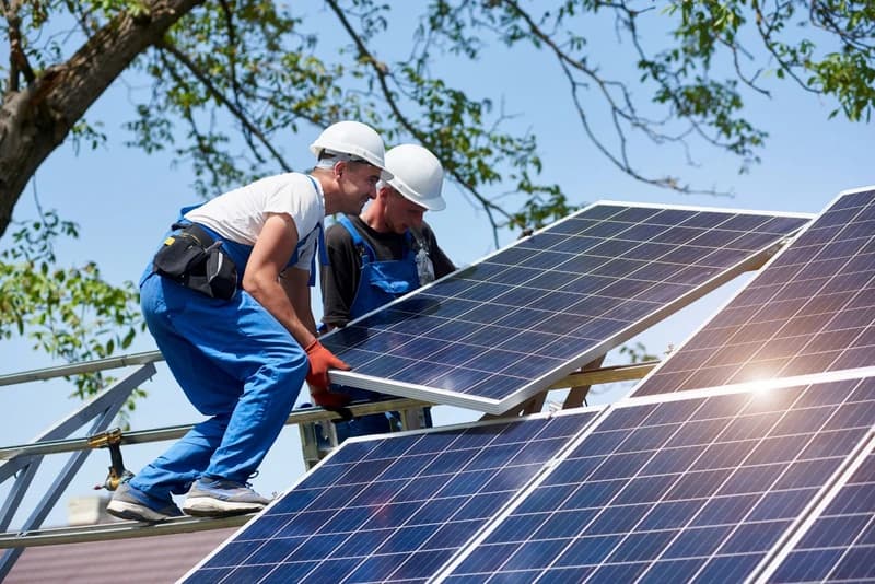 two men doing solar panel work