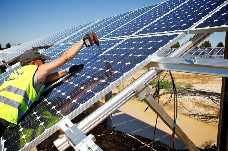 Man applying a solar panel